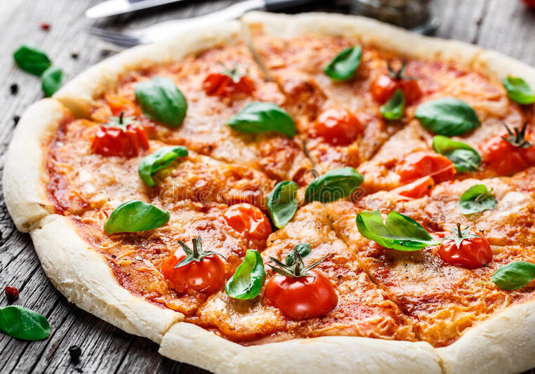 pizza-margherita-italian-wooden-table-53766599